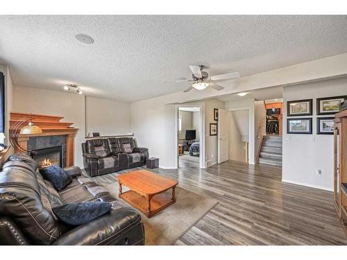 523 Stonegate Way Nw, Airdrie, AB - Indoor Photo Showing Living Room With Fireplace