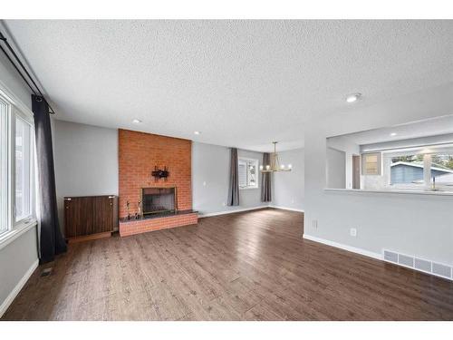 4307 45 Street Sw, Calgary, AB - Indoor Photo Showing Living Room With Fireplace