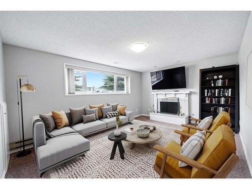 4307 45 Street Sw, Calgary, AB - Indoor Photo Showing Living Room With Fireplace