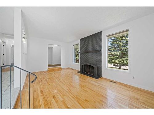 343 Pinetree Road Ne, Calgary, AB - Indoor With Fireplace