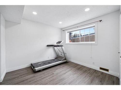12152 Canfield Road Sw, Calgary, AB - Indoor Photo Showing Gym Room