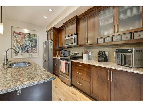 222 Quarry Park Boulevard Se, Calgary, AB - Indoor Photo Showing Kitchen With Double Sink