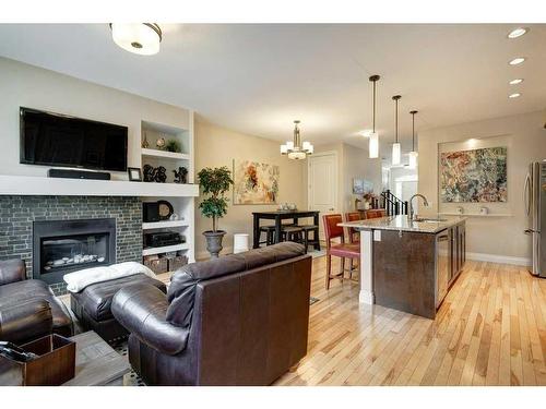 222 Quarry Park Boulevard Se, Calgary, AB - Indoor Photo Showing Living Room With Fireplace
