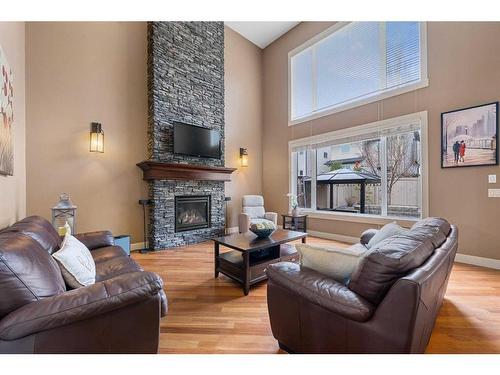 163 Panatella View Nw, Calgary, AB - Indoor Photo Showing Living Room With Fireplace