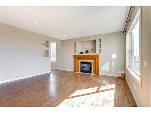 99 Pantego Way Nw, Calgary, AB - Indoor Photo Showing Living Room With Fireplace