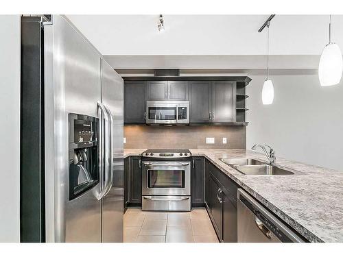 2405-310 Mckenzie Towne Gate Se, Calgary, AB - Indoor Photo Showing Kitchen With Double Sink With Upgraded Kitchen
