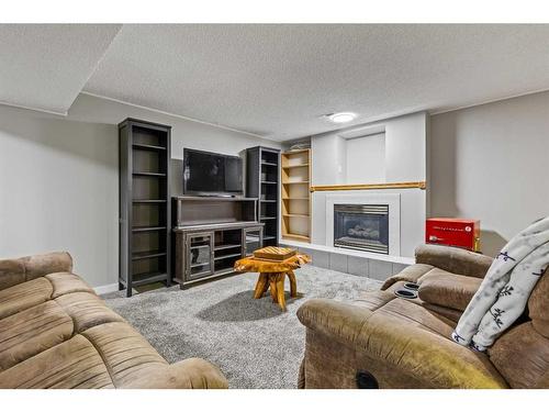 456 Cedarille Crescent Sw, Calgary, AB - Indoor Photo Showing Living Room With Fireplace