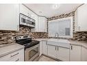 19 Mckernan Road Se, Calgary, AB  - Indoor Photo Showing Kitchen With Double Sink With Upgraded Kitchen 