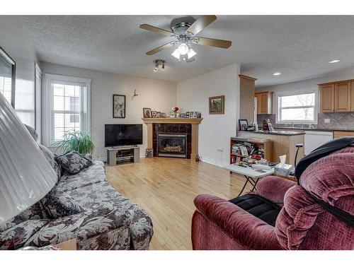 417 Regal Crescent, Trochu, AB - Indoor Photo Showing Living Room With Fireplace