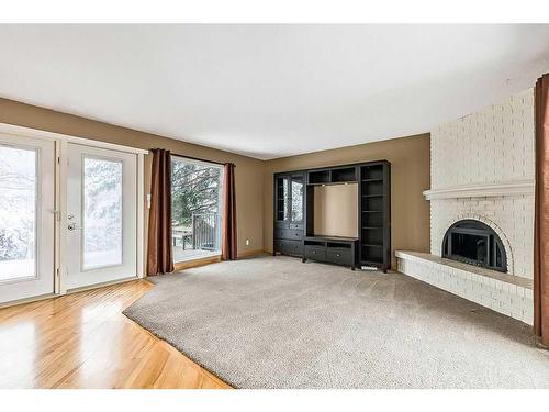 11003 Brae Road Sw, Calgary, AB - Indoor Photo Showing Living Room With Fireplace