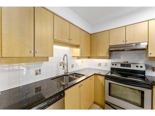 404-650 10 Street Sw, Calgary, AB - Indoor Photo Showing Kitchen With Double Sink