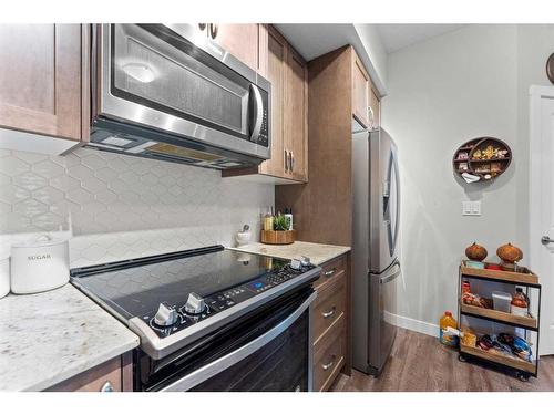 2115-3727 Sage Hill Drive Nw, Calgary, AB - Indoor Photo Showing Kitchen With Upgraded Kitchen