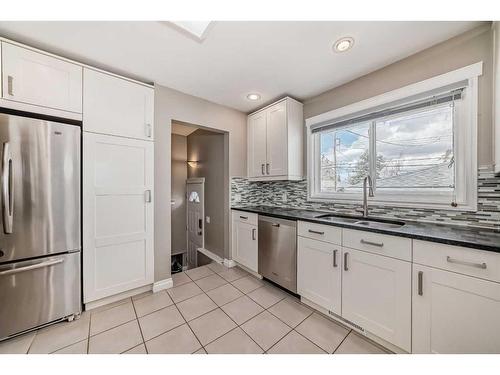 110 Warwick Drive Sw, Calgary, AB - Indoor Photo Showing Kitchen With Stainless Steel Kitchen With Double Sink