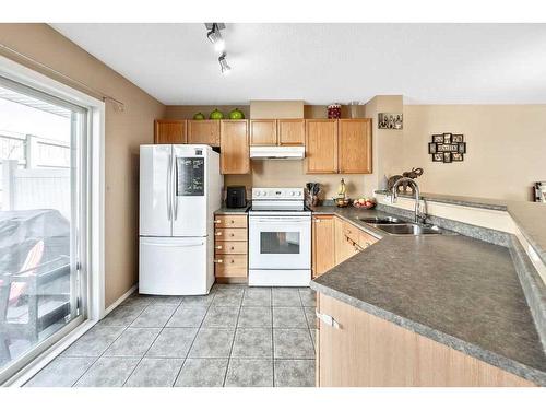 103 Tuscany Springs Gardens Nw, Calgary, AB - Indoor Photo Showing Kitchen With Double Sink