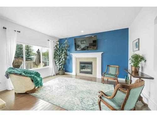 112 Ridge View Close, Cochrane, AB - Indoor Photo Showing Living Room With Fireplace