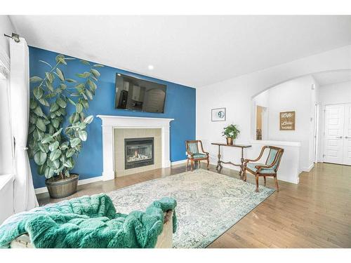 112 Ridge View Close, Cochrane, AB - Indoor Photo Showing Living Room With Fireplace