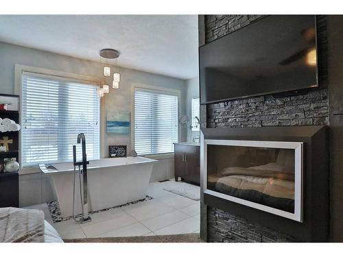 148 Hidden Circle Nw, Calgary, AB - Indoor With Fireplace