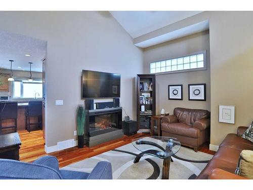 148 Hidden Circle Nw, Calgary, AB - Indoor Photo Showing Living Room With Fireplace