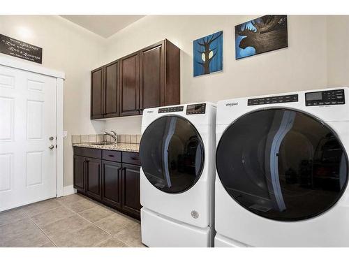 134 Montenaro Crescent, Rural Rocky View County, AB - Indoor Photo Showing Laundry Room