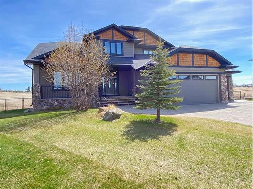 134 Montenaro Crescent, Rural Rocky View County, AB - Outdoor With Facade