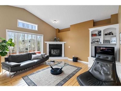 242 Mt Alberta Place Se, Calgary, AB - Indoor Photo Showing Living Room With Fireplace