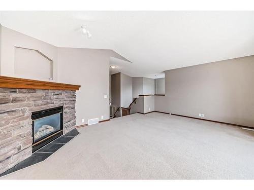 70 Cranfield Crescent Se, Calgary, AB - Indoor Photo Showing Living Room With Fireplace