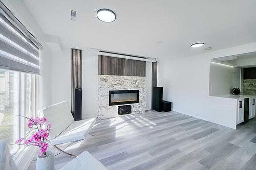 155 Scurfield Place Nw, Calgary, AB - Indoor Photo Showing Living Room With Fireplace