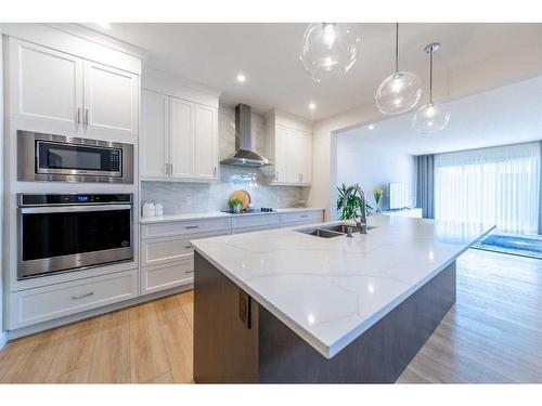 48 Cranbrook Manor Se, Calgary, AB - Indoor Photo Showing Kitchen With Double Sink With Upgraded Kitchen