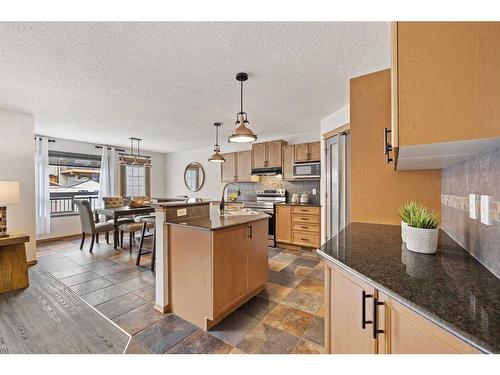 513 Coopers Drive Sw, Airdrie, AB - Indoor Photo Showing Kitchen