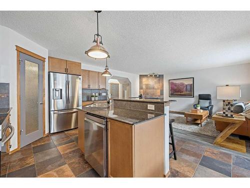 513 Coopers Drive Sw, Airdrie, AB - Indoor Photo Showing Kitchen With Stainless Steel Kitchen