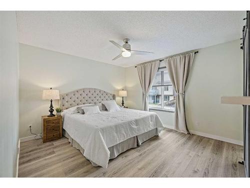 513 Coopers Drive Sw, Airdrie, AB - Indoor Photo Showing Bedroom