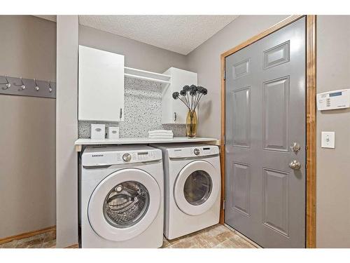 513 Coopers Drive Sw, Airdrie, AB - Indoor Photo Showing Laundry Room
