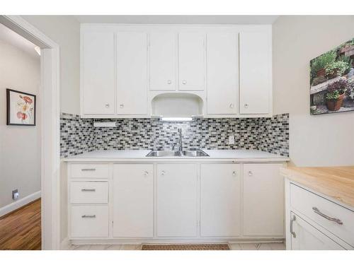 220 12A Street Ne, Calgary, AB - Indoor Photo Showing Kitchen With Double Sink