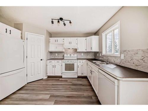 45 Cimarron Meadows Road, Okotoks, AB - Indoor Photo Showing Kitchen With Double Sink