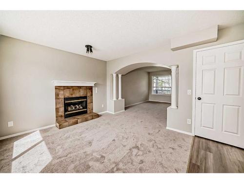 45 Cimarron Meadows Road, Okotoks, AB - Indoor With Fireplace