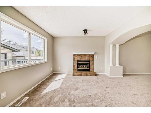 45 Cimarron Meadows Road, Okotoks, AB - Indoor Photo Showing Living Room With Fireplace