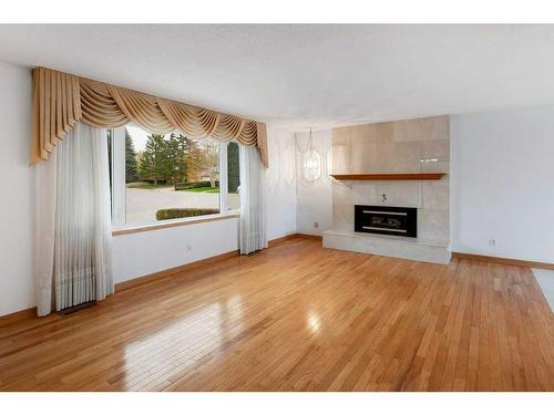 6411 Silver Springs Way Nw, Calgary, AB - Indoor Photo Showing Living Room With Fireplace