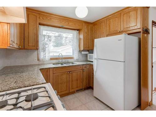 6411 Silver Springs Way Nw, Calgary, AB - Indoor Photo Showing Kitchen With Double Sink