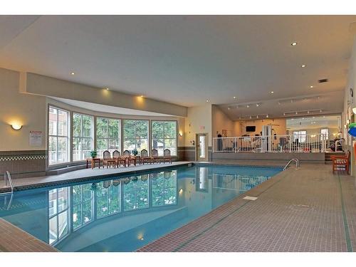 236-2200 Marda Link Sw, Calgary, AB - Indoor Photo Showing Other Room With In Ground Pool
