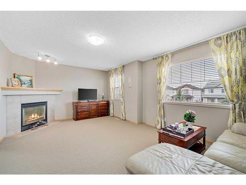 78 Bridlecrest Boulevard Sw, Calgary, AB - Indoor Photo Showing Living Room With Fireplace