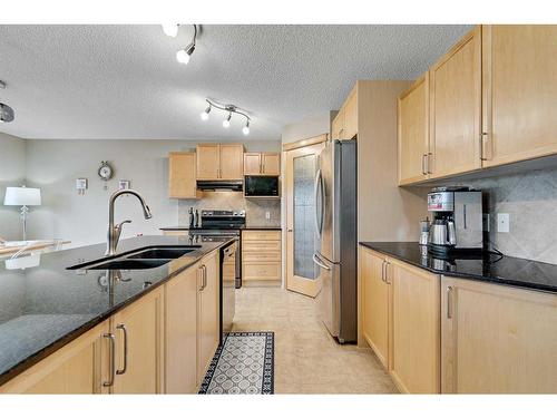 78 Bridlecrest Boulevard Sw, Calgary, AB - Indoor Photo Showing Kitchen With Stainless Steel Kitchen With Double Sink