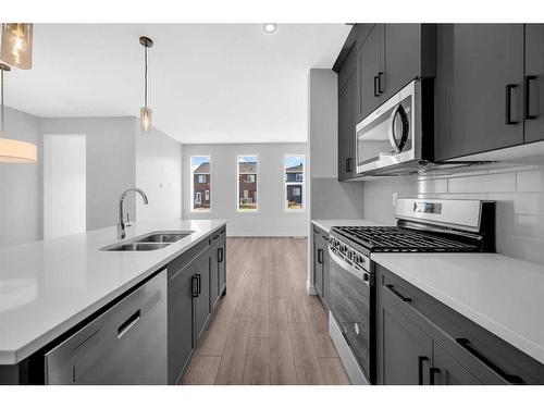 103 Amblefield Avenue Nw, Calgary, AB - Indoor Photo Showing Kitchen With Double Sink With Upgraded Kitchen