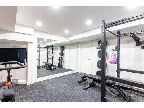 1149 Coopers Drive Sw, Airdrie, AB - Indoor Photo Showing Gym Room