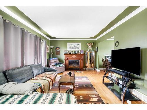 1501,1507,1511,1515 35 Street Se, Calgary, AB - Indoor Photo Showing Living Room With Fireplace