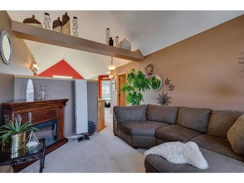 128 Lakeview Cove, Chestermere, AB - Indoor Photo Showing Living Room With Fireplace
