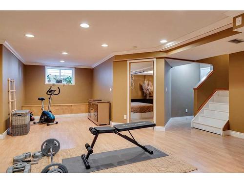 128 Lakeview Cove, Chestermere, AB - Indoor Photo Showing Gym Room