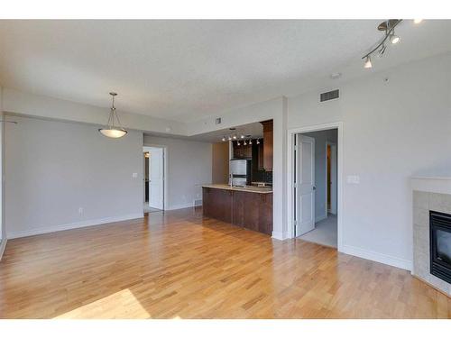 2504-910 5 Avenue Sw, Calgary, AB - Indoor With Fireplace