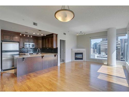 2504-910 5 Avenue Sw, Calgary, AB - Indoor With Fireplace