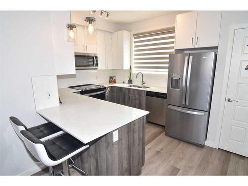 828 Belmont Drive Sw, Calgary, AB - Indoor Photo Showing Kitchen With Stainless Steel Kitchen With Double Sink