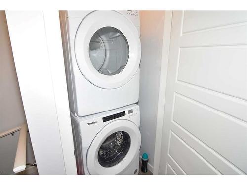 828 Belmont Drive Sw, Calgary, AB - Indoor Photo Showing Laundry Room